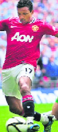 Man U's Nani scores the winning goal during FA Community Shield match against Man City in London on Sunday. United won 3-2
