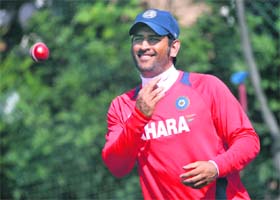 Mahendra Singh Dhoni throws a ball during a training session at Edgbaston in Birmingham on Monday