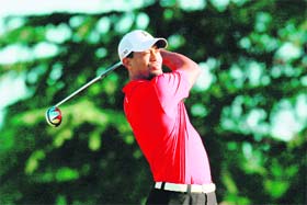Tiger Woods hits a shot on the 10th hole during the first round of the 93rd PGA Championship at the Atlanta Athletic Club on Thursday