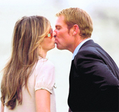 Shane Warne shares a kiss with girlfriend Elizabeth Hurley after the third Test match at Edgbaston ground in Birmingham. 
