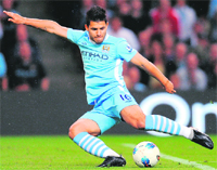 Man City's Sergio Aguero shoots during the EPL match in Manchester on Monday. 