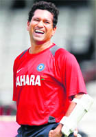 Tendulkar laughs during a practice session at The Oval in London 