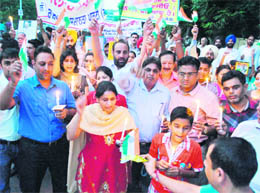 Members of an NGO take out a candlelight march in support of Anna Hazare at the Mall road in Patiala on Thursday.