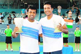 Leander Paes and Mahesh Bhupathi with their trophies after winning the final of Western & Southern Open in Mason, Ohio on Sunday
