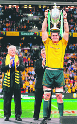 Australian captain James Horwill holds aloft the trophy after their win against New Zealand (25-20) during the Tri-Nations rugby match in Brisbane on Friday. The Wallabies won the Tri-Nations series. 