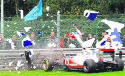 McLaren Mercedes' Lewis Hamilton crashes at the Spa-Francorchamps circuit during the Belgium GP