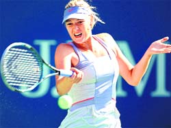 Maria Sharapova fires a return against Heather Watson in the US Open on Monday.� AFP