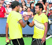 Leander Paes with Mahesh Bhupati during the men�s doubles in New York on Monday. 