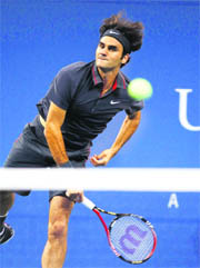 Roger Federer serves to Jo-Wilfried Tsonga in the quarterfinal of the US Open in New York on Thursday. Federer won in straight sets. 