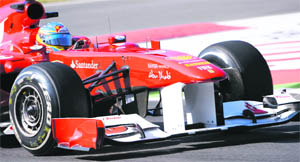 Ferrari�s Fernando Alonso takes a curve during the free practice session for the Italian GP at the Monza circuit on Friday. 
