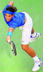 Rafael Nadal returns against Andy Roddick in the US Open in New York