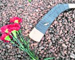A hockey stick and flowers lie in front of the Czech Embassy in Moscow on Saturday. Russia mourned the deaths of 43 people including players of top ice hockey team Lokomotiv Yaroslavl killed in a plane crash near the city of Yaroslavl