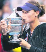 Samantha Stosur of Australia kisses the trophy after beating Serena Williams in the women�s singles final at the US Open on Sunday.