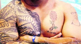 Australia�s rugby player Salesi Ma�afu flaunts his tattoos at the World Cup in Auckland on Monday.
