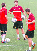 Manchester United players warm up for their training session at Luz stadium in Lisbon