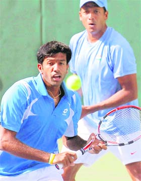 Rohan Bopanna (L) and Mahesh Bhupati in action during their World Group Playoff against Japan on Saturday