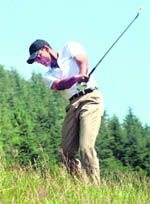 A golfer tees off during the Chalets Naldehra Golf Tournament at Naldehra on Sunday. 