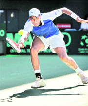 Vishnu Vardhan hits a return aganist Kei Nishikori of Japan during their Davis Cup world group play-off match in Tokyo on Sunday. 