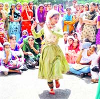 A girl performs dance during a talent hunt competition for Punjabi University Zonal Youth Festival in Patiala on Tuesday.