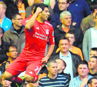 Liverpool's Luis Suarez celebrates after scoring in England on Saturday. 