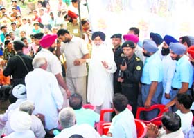 Chief Minister Parkash Singh Badal interacts with flood-affected villagers at Muhar Jamsher village in Fazilka on Tuesday