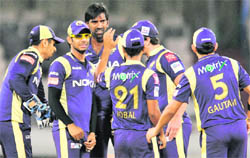 Kolkata Knight Riders� Lakshmipathy Balaji (C) celebrates taking the wicket of South Australia Redbacks� Daniel Harris during their Champions League T20 match in Hyderabad 