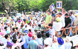 A van carrying the body of Gursharan Singh at the Sector 25 crematorium in Chandigarh.