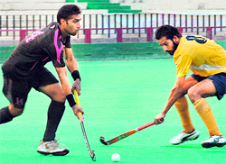 Players of Punjab & Sind Bank and Indian Oil Corporation in action on Friday