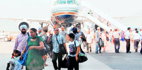Passengers from Vienna land at the Amritsar airport on Sunday.