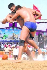 India�s Rubeljeet Singh and Pakistan�s Ahmad Butt in action during the Preet International Wrestling Tournament in Patiala on Wednesday
