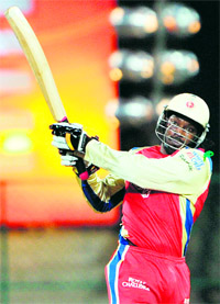 Chris Gayle hits a six during his knock of 92 in the Champions League semifinal against New South Wales Blues in Bangalore on Friday.
