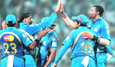Mumbai Indians� Kieron Pollard (R) celebrates with teammates during the Champions League Twenty20 final match against RCB at the M.A Chidambaram Stadium in Chennai on Sunday