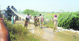 Cops try to disperse protesters in Gobindpura.
