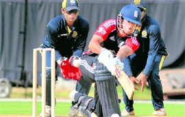 England�s Craig Kieswetter sweeps during a warm-up match with HCA XI in Hyderabad on Tuesday.