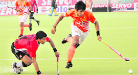 Match between ONGC and PNB in progress in Jalandhar on Tuesday.