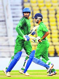 Harbhajan Singh and Iqbal Abdullah (R) of India Green in action during the NKP Salve Challenger trophy against India Red in Nagpur on Thursday
