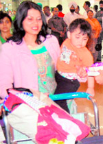 Passengers arrive at the Amritsar airport