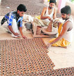 Potters prepare earthen lamps for Diwali in Patiala