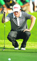 David Gleeson of Australia lines up a putt during The Hero Indian Open in New Delhi 