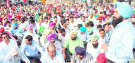 Members of the Sikhiya Karmi Adhiyapak Union sit on a dharna at Gagan Chowk in Rajpura.