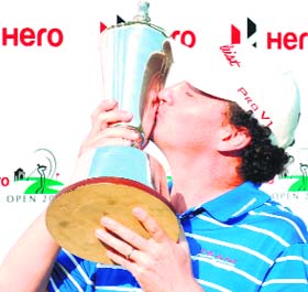 David Gleeson of Australia poses with the trophy after winning the Hero Indian Open at the Delhi Golf Club in New Delhi on Sunday