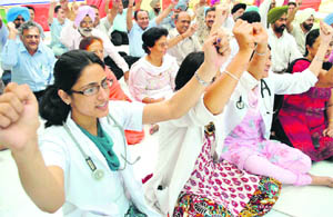 PCMS doctors and members of the medical fraternity protest at the Government Rajindra Hospital in Patiala. 
