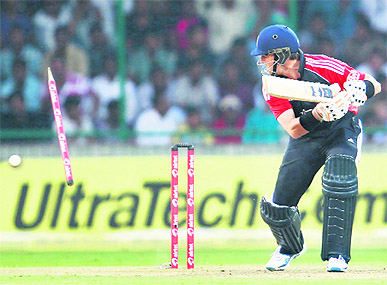England's Graeme Swann looks back at the wickets as he is bowled by Vinay Kumar during the second ODI in New Delhi on Monday. India won the match by 8 wickets. 