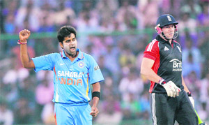 R Vinay Kumar celebrates the wicket of Tim Bresnan on Monday.