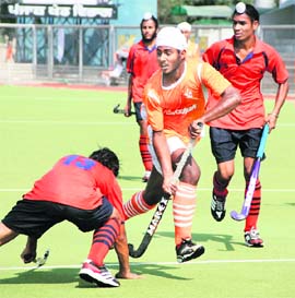 A match in progress during Balwant Singh Kapur Hockey tournament on Wednesday.