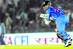 Ajinkya Rahane takes a run after playing a shot against England at the PCA Stadium in Mohali on Thursday. India won the match by 5 wickets