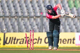 Jonathan Trott is bowled by Vinay Kumar during the fourth one-day international in Mumbai on Sunday