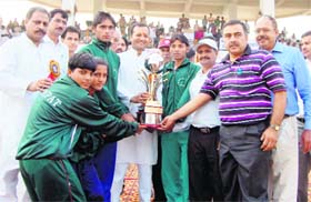 Congress MP Naveen Jindal presents the overall trophy to Team Sonepat at the closing ceremony of the Haryana State Games in Gurgaon on Sunday