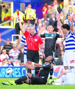 Referee Chris Foy (L) shows a red card to Chelsea's Didier Drogba (bottom left) in London on Sunday.