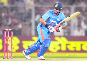 Suresh Raina plays a shot during the Twenty20 match against England at the Eden Gardens in Kolkata on Saturday. England won the match by six wickets.